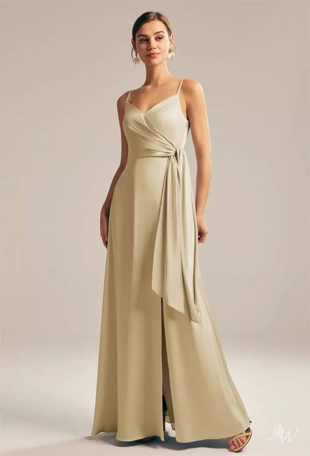 A champagne satin bridesmaid gown with a wrap-style waist tie