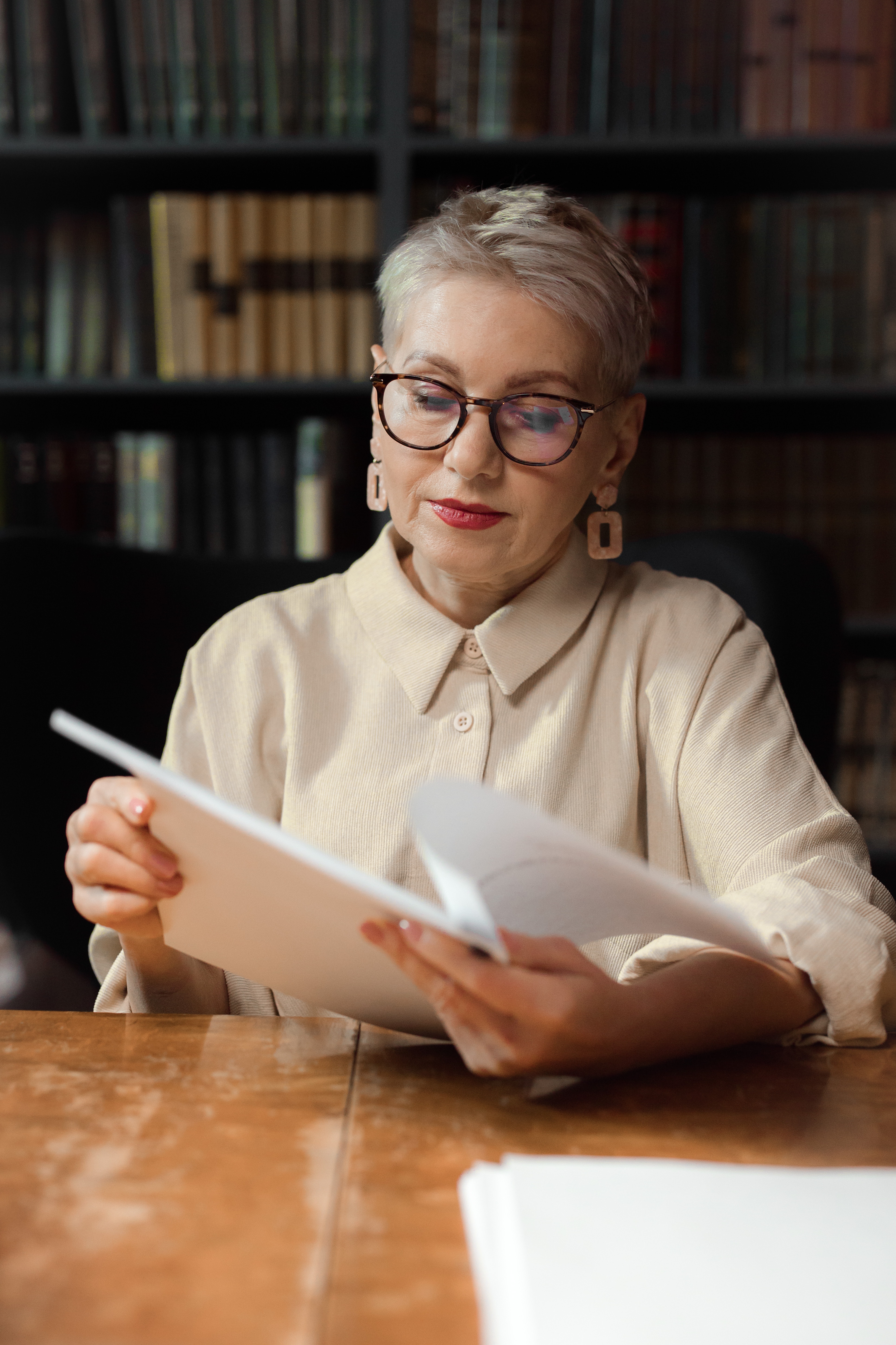 Person reviewing and organizing a wedding ceremony script to plan the ceremony structure