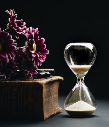 Hourglass representing time to finalize wedding guest list decisions and invitations Hourglass representing time to finalize wedding guest list decisions and invitations