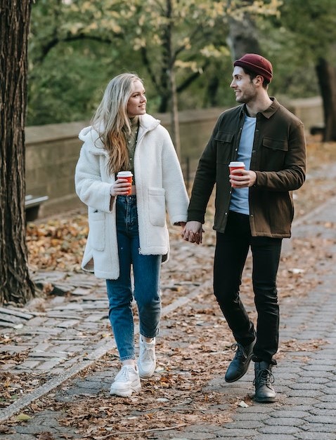 Couple walking together representing close relationships for wedding guest list inner circle decisions Couple walking together representing close relationships for wedding guest list inner circle decisions