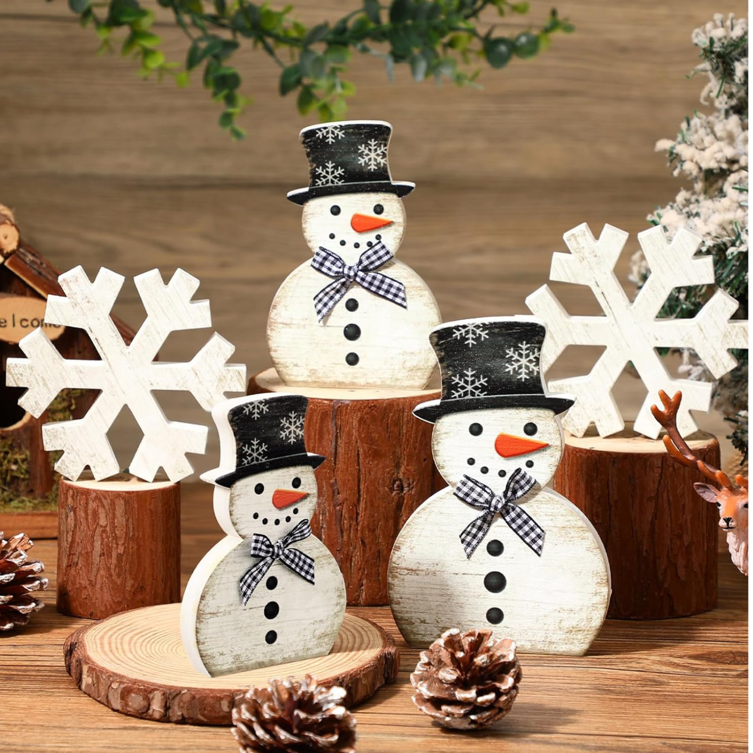 group of 3 wooden tabletop snowmen and 2 wooden tabletop snowflakes
